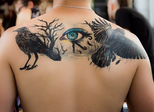 horus Horus eye tattoo on men's back