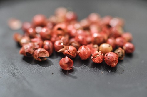 Red Peppercorns on Black Background