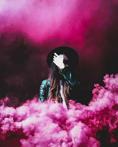 Woman in pink smoke background