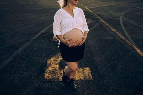pregnant woman on a race track