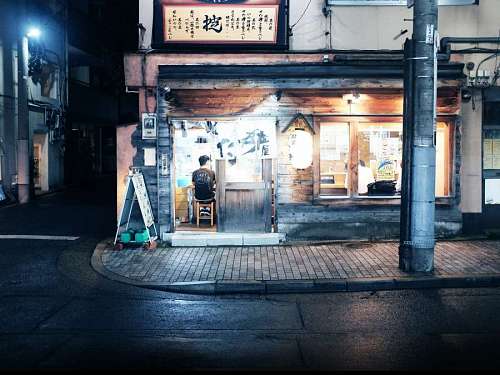 tokyo A person at a food stall in Tokyo at night