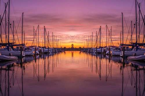 Mooring with boats at sunset