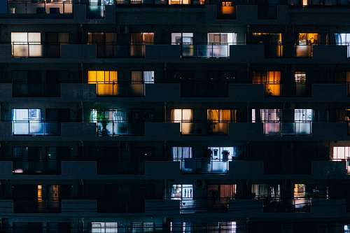 Windows with lights on in a building at night