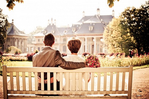 expecting Romantic couple contemplating landscape