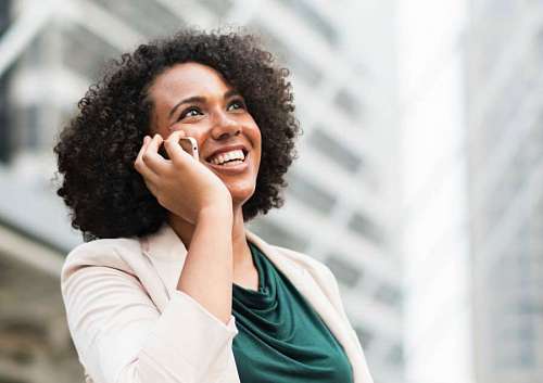 curler Woman talking by cellphone and smiling