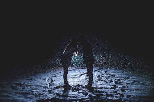 kissing-forehead Couple kissing in the snow