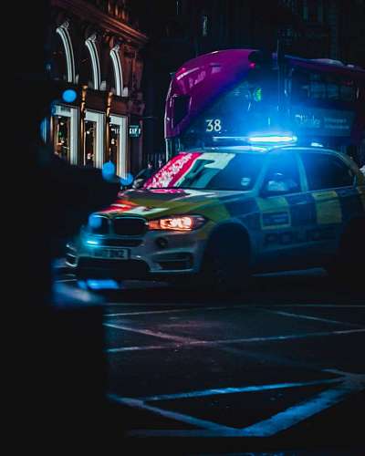 police car patrolling at night