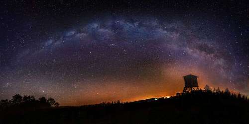 Night landscape with the milky way in the background