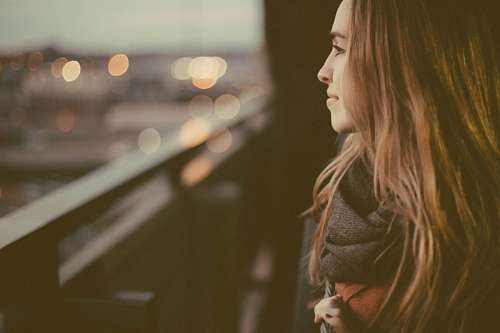 Woman looking through a windows