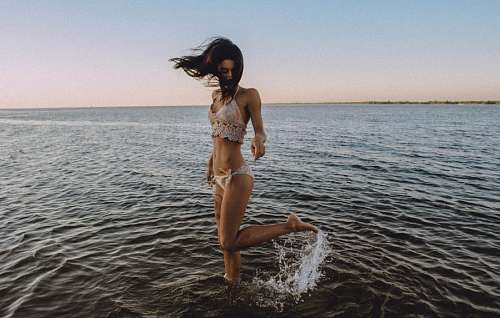 Woman playing at sea coast