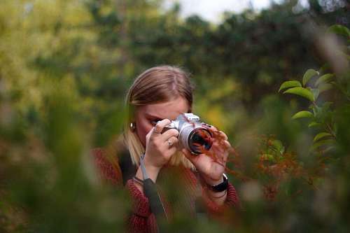 Young woman photographing nature