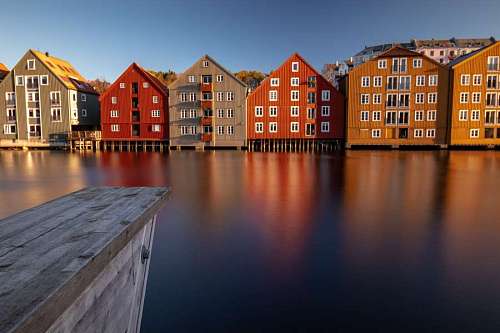 row Colorful houses facing a canal in Amsterdam