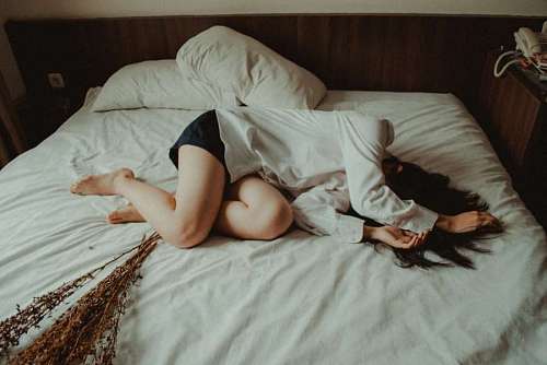 despair Sad woman in bed