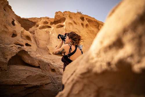 hiker Woman taking pictures on a mountain