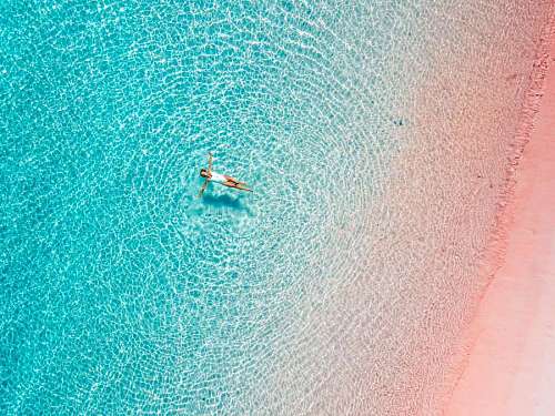 Woman swimming in tropical waters