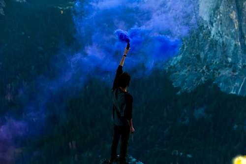 point-of-sale Man on the mountain with blue flare