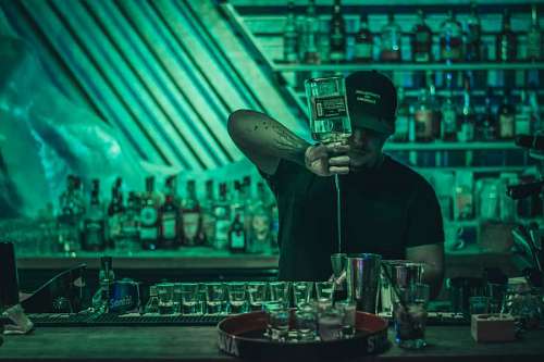 barman preparing white drink drinks