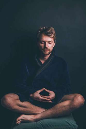 young man meditating