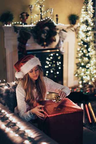 robe Woman at home opening christmas gift