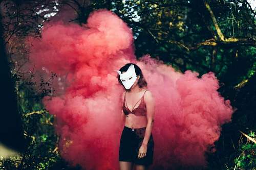 wolf Woman among pink smoke