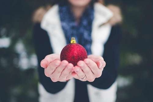 christmastime Woman holding Christmas ball 