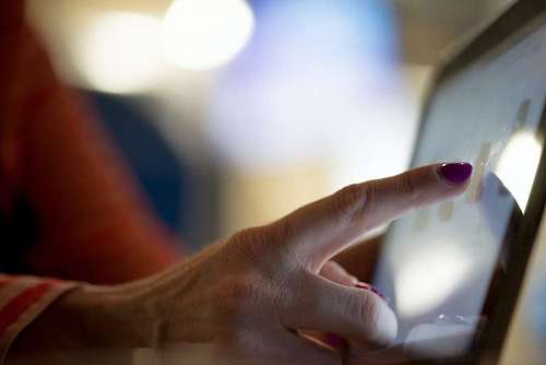 adolescence Adult woman touching screen tactile from tablet