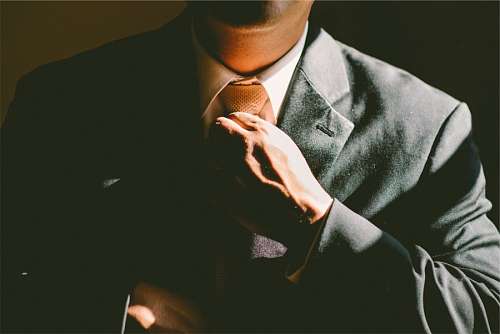 adjusting Businessman Adjusting His Tie