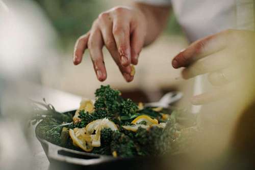 close-up of cook preparing delicious vegetables