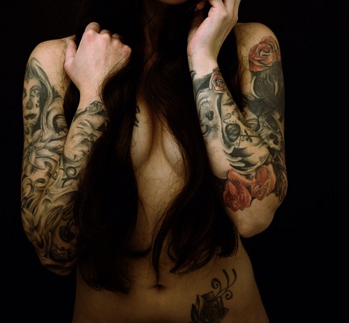 Sensual woman in front with tattoos