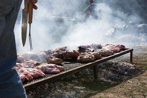 Argentine gaucho preparing a barbecue in the field