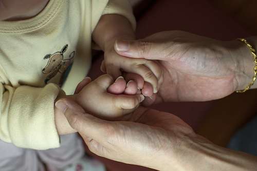 grandmother Grandmother taking small hands of her grandson