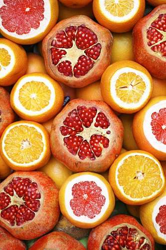 Background of fruits, pomegranates, oranges and grapefruit