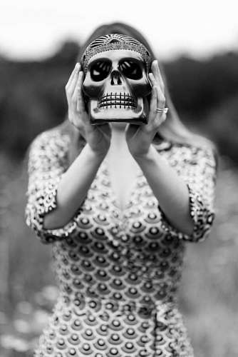 haunted Woman holding ceramic skull