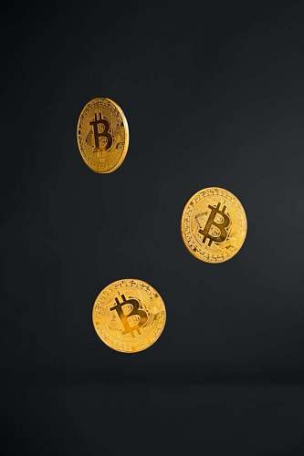 Bitcoin coins on black background