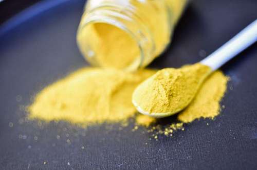 eastern Heap of curcuma powder isolated on Black background