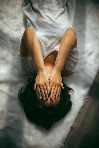Woman covering her face