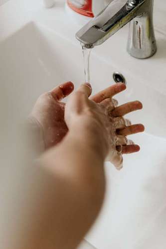route close-up of a person washing his hands properly