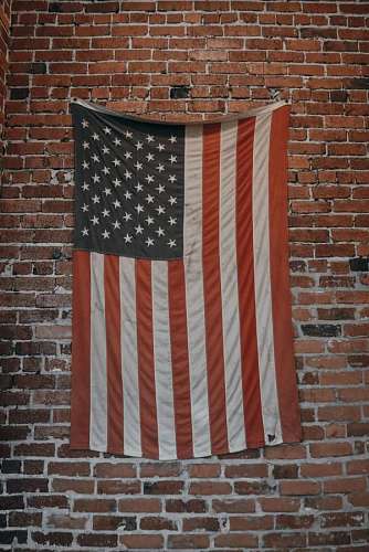 brick USA Flag against a brick wall
