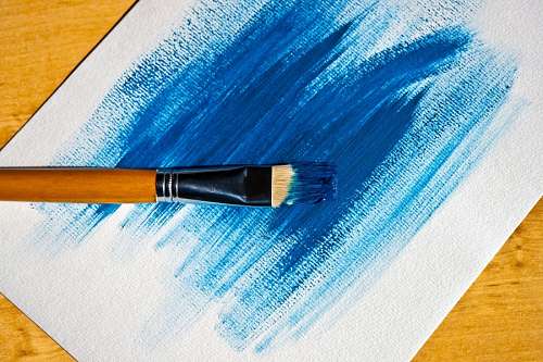 Brush with blue paint
