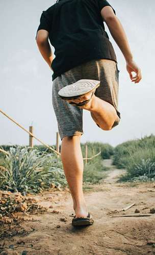 man running on a dirt path