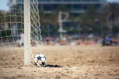 juan soccer sport ball, bow, red, shot, sand, front vie