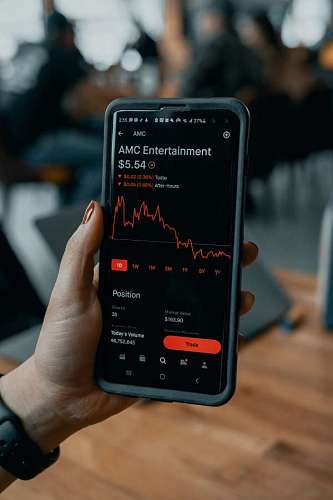 A person looking at cryptocurrency performance on his phone