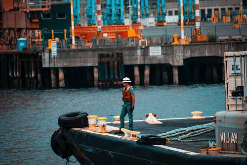 worker at the tip of a pier