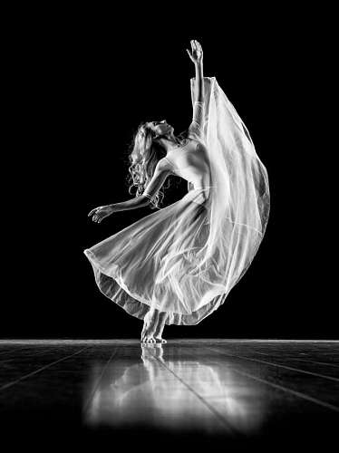 woman doing ballet with a black background