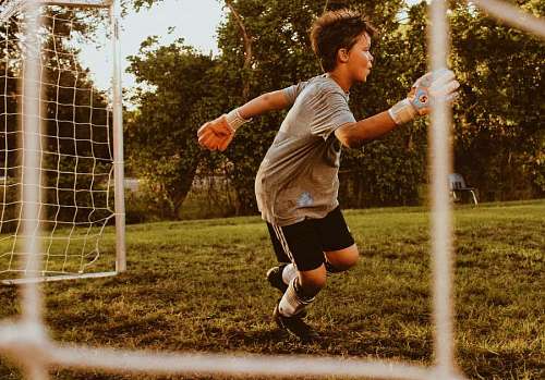 grams Child playing soccer
