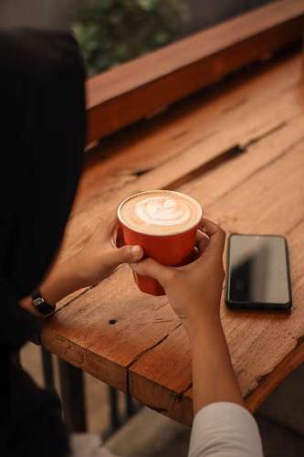 close-up of a woman about to drink a coffee