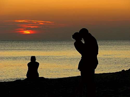 kissing-forehead Couple of lovers at sunset