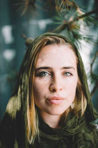Portrait of a blue-eyed young woman looking at the camera