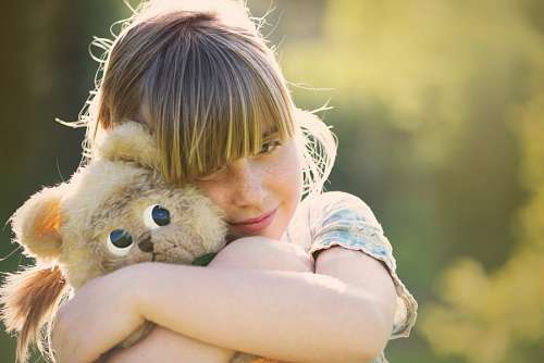 Girl hugging teddy