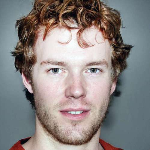 Portrait of a red-haired man looking at the camera